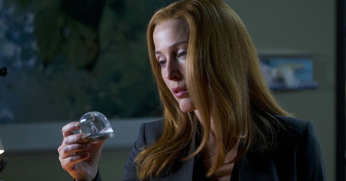 Scully with a snow globe