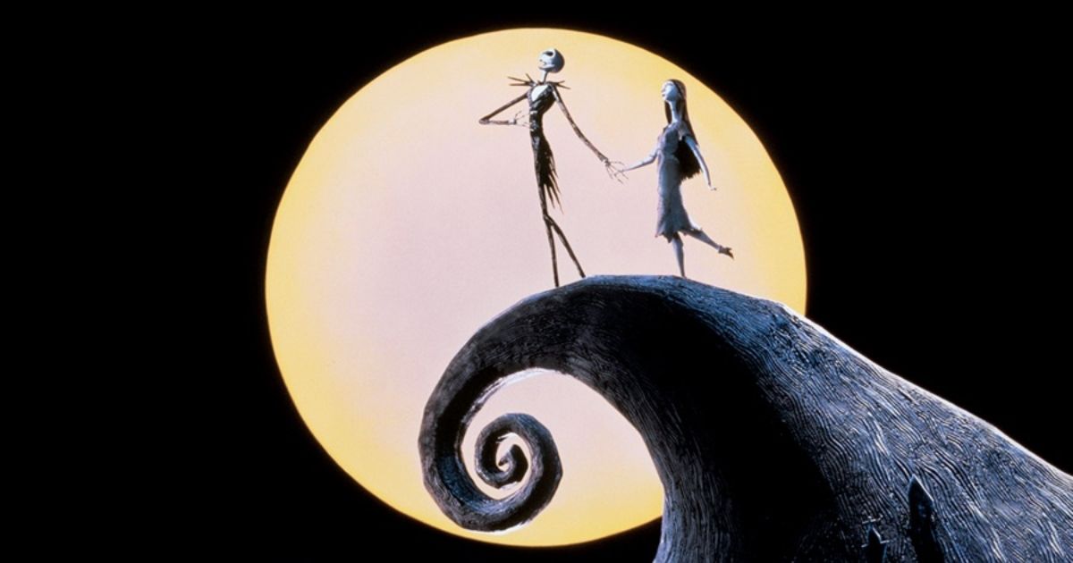 The Nightmare Before Christmas characters stand atop a mountain with the moon in the background.