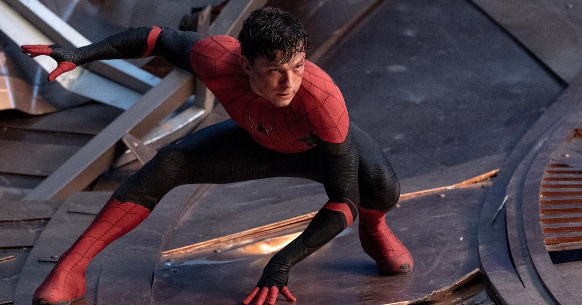 Tom Holland as Spider-Man in black and red suit unmasked