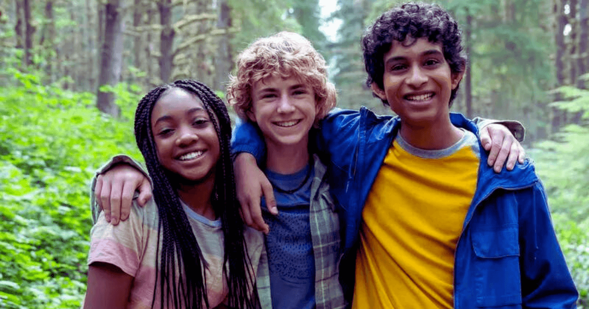 Percy Jackson and the Olympians cast in the woods taking a set photo