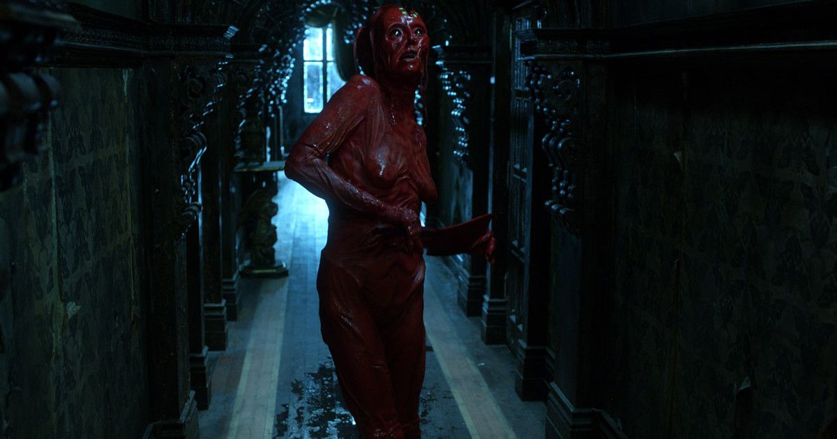 Javier Botet walks as bloodied creature Enola in Crimson Peak