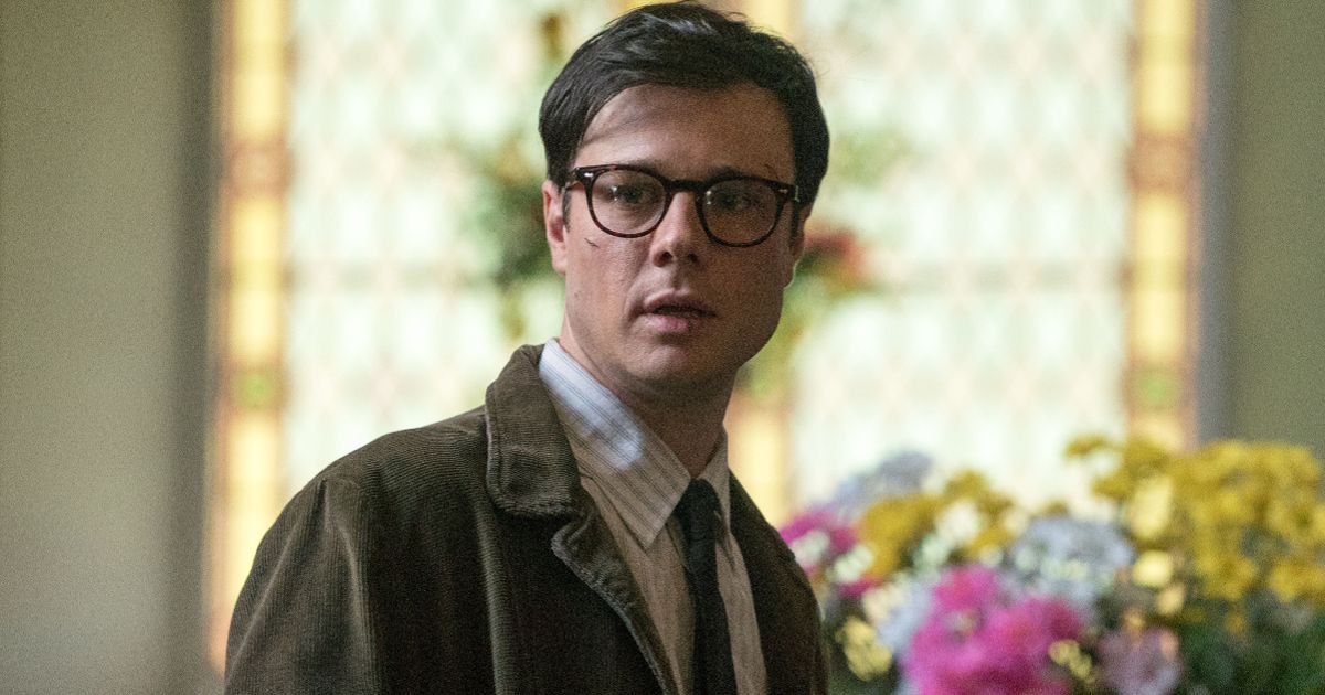 Franks stands by flowers in The Man in the High Castle