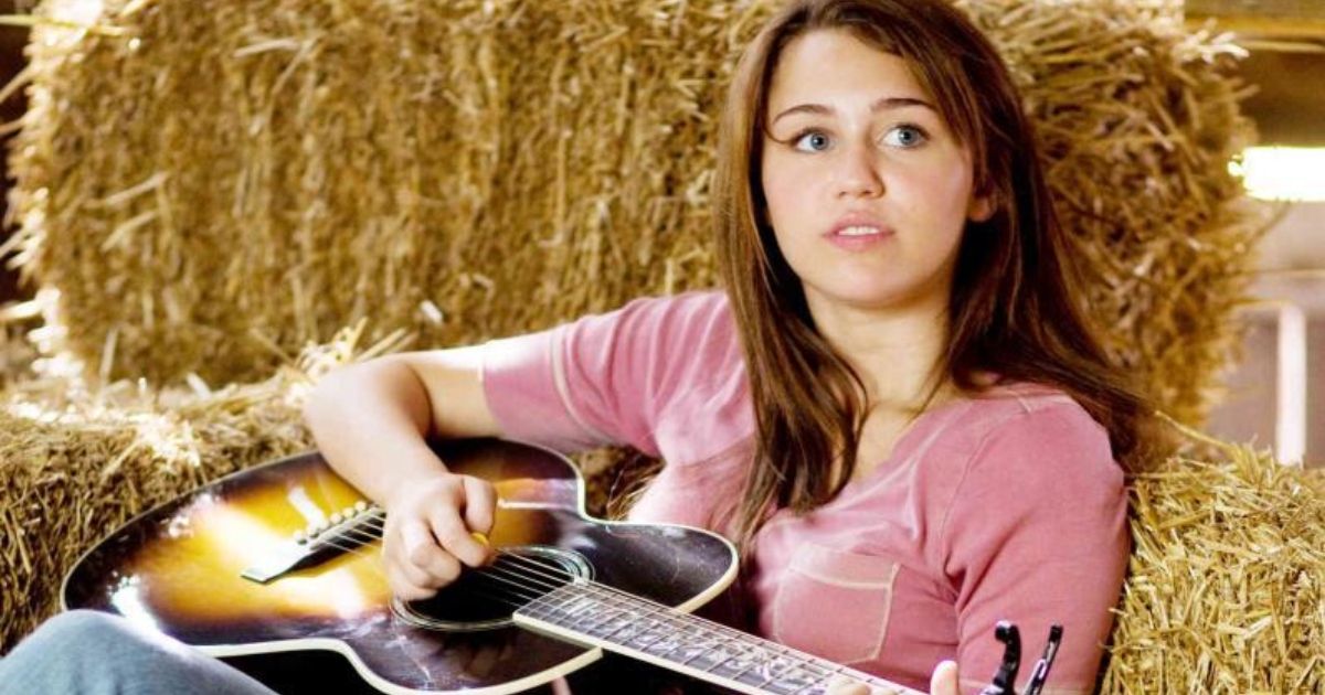 Miley playing a guitar in Hannah Montana_ The Movie