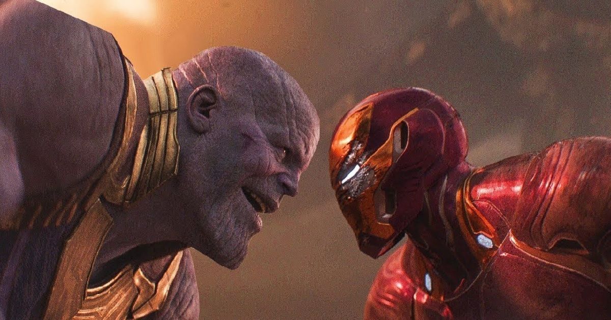 Iron Man and Thanos staring at each other on Titan as they fight in Avengers: Infinity War.
