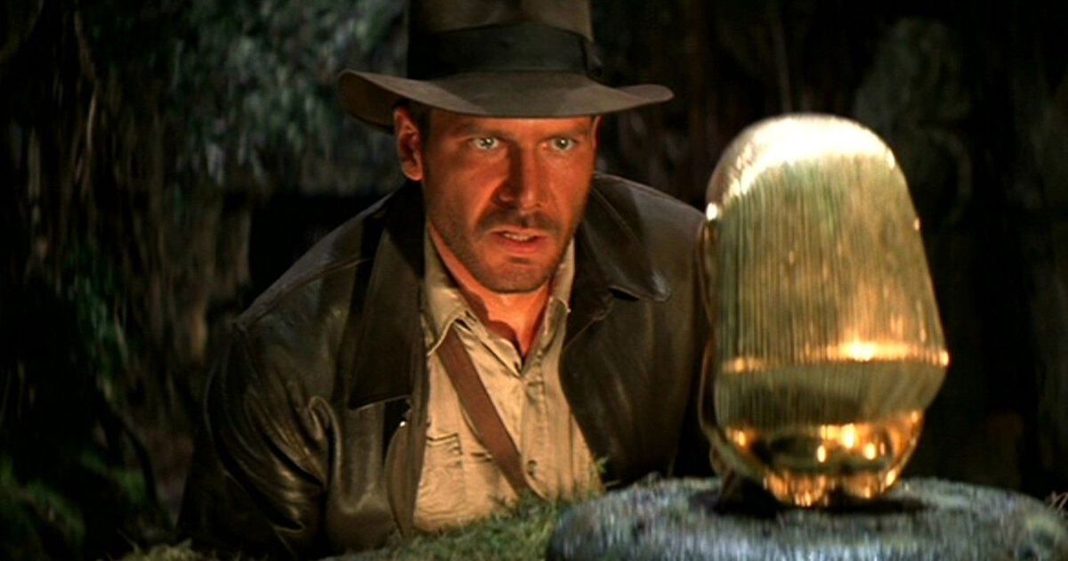 indiana jones stares at a golden object in Raiders of the Lost Ark