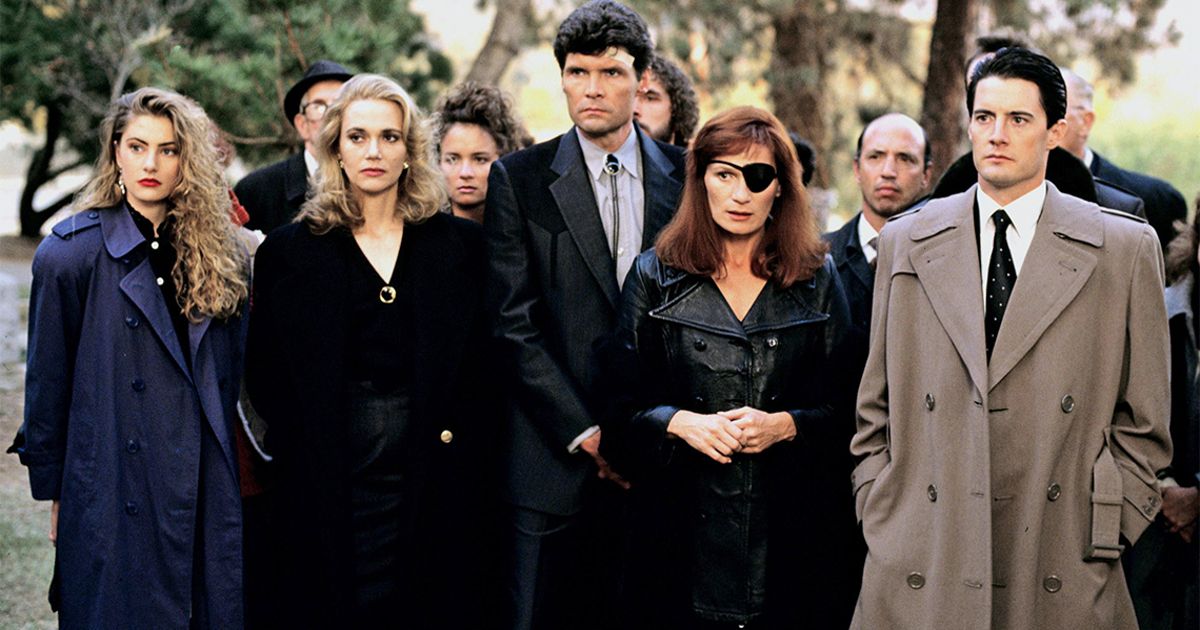 The cast of Twin Peaks stands in a cemetery