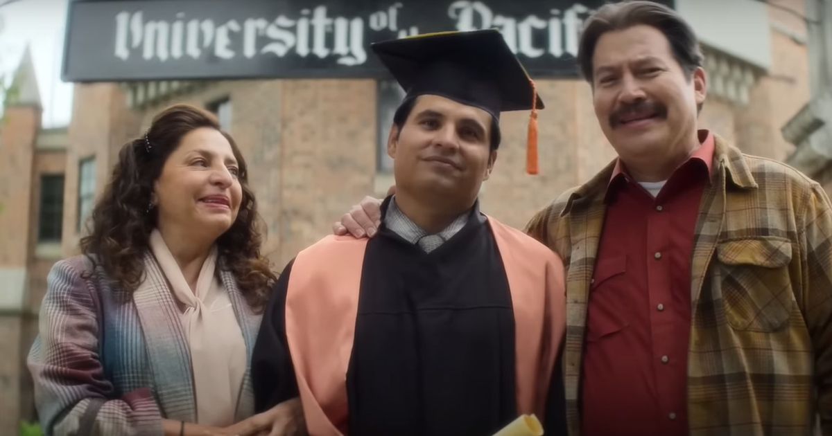 Jose and his parents pose at graduation in A Million Miles Away