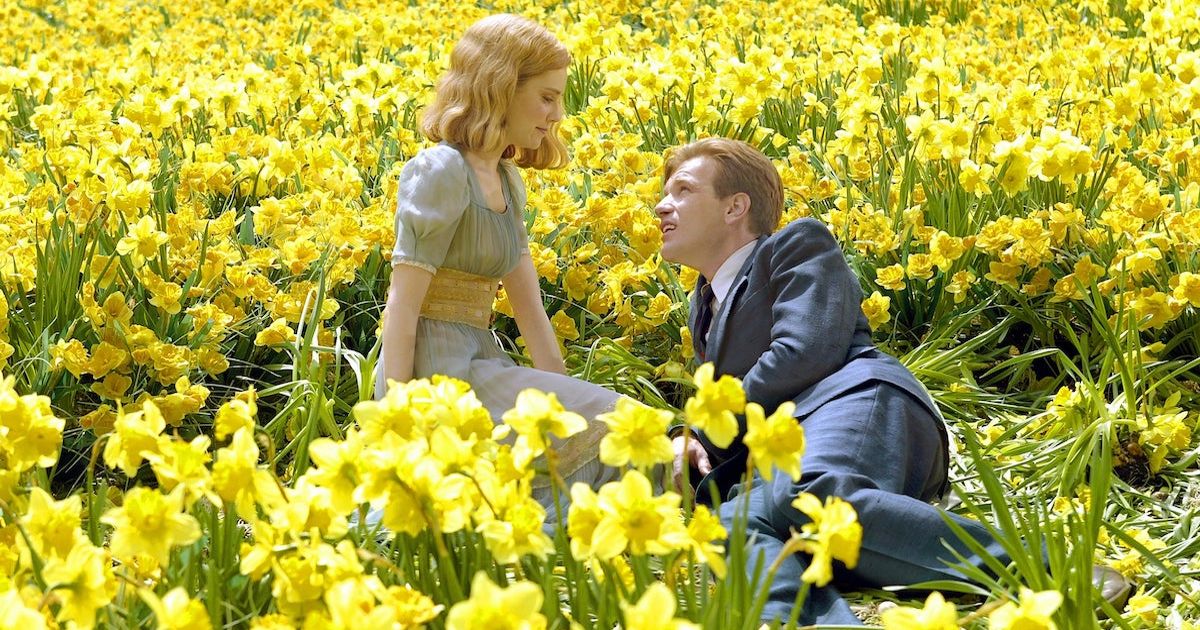 Will lays in a flower field in Big Fish