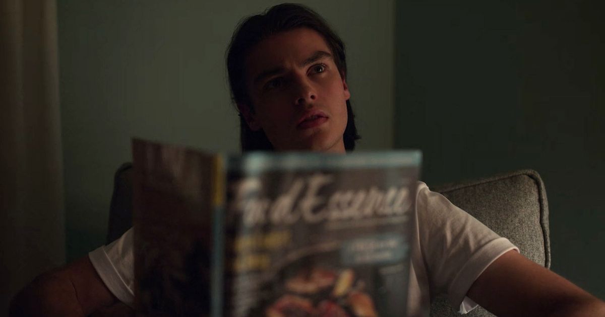 Lucas holds a food magazine in Locke & Key