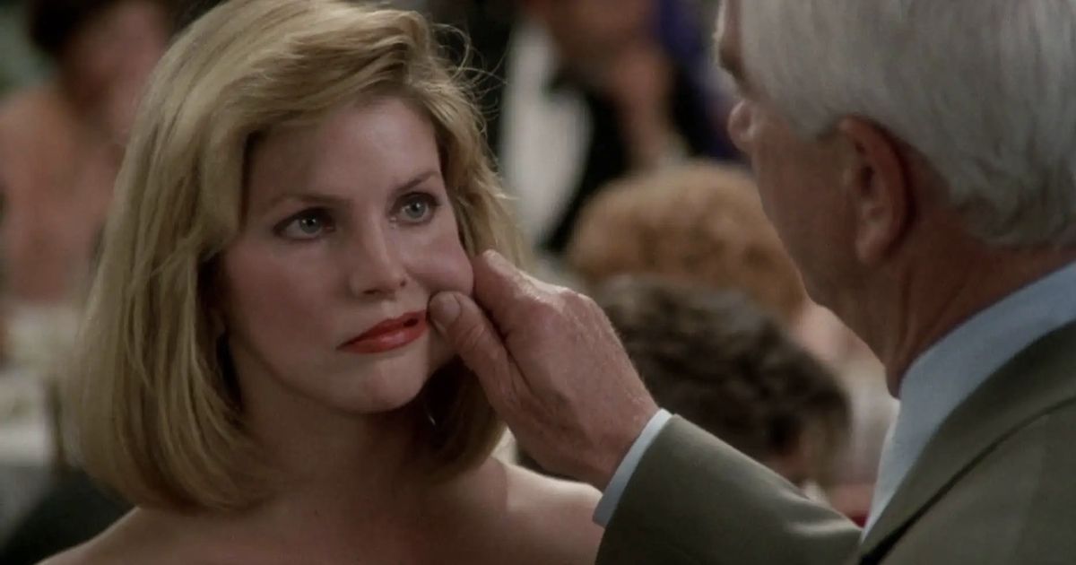 Frank pinches Jane's cheek in The Naked Gun