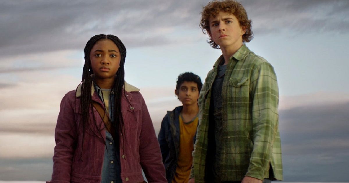 Three main characters from Percy Jackson and the Olympians look at something