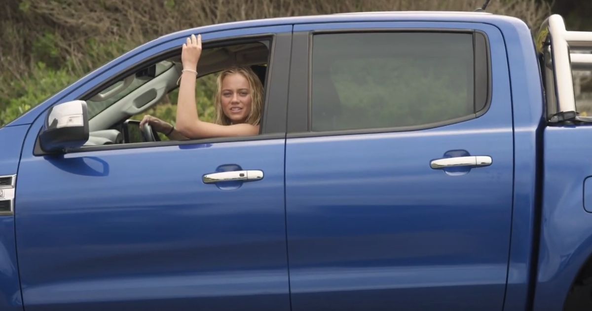 Sheridan sits in her truck in Surviving Summer