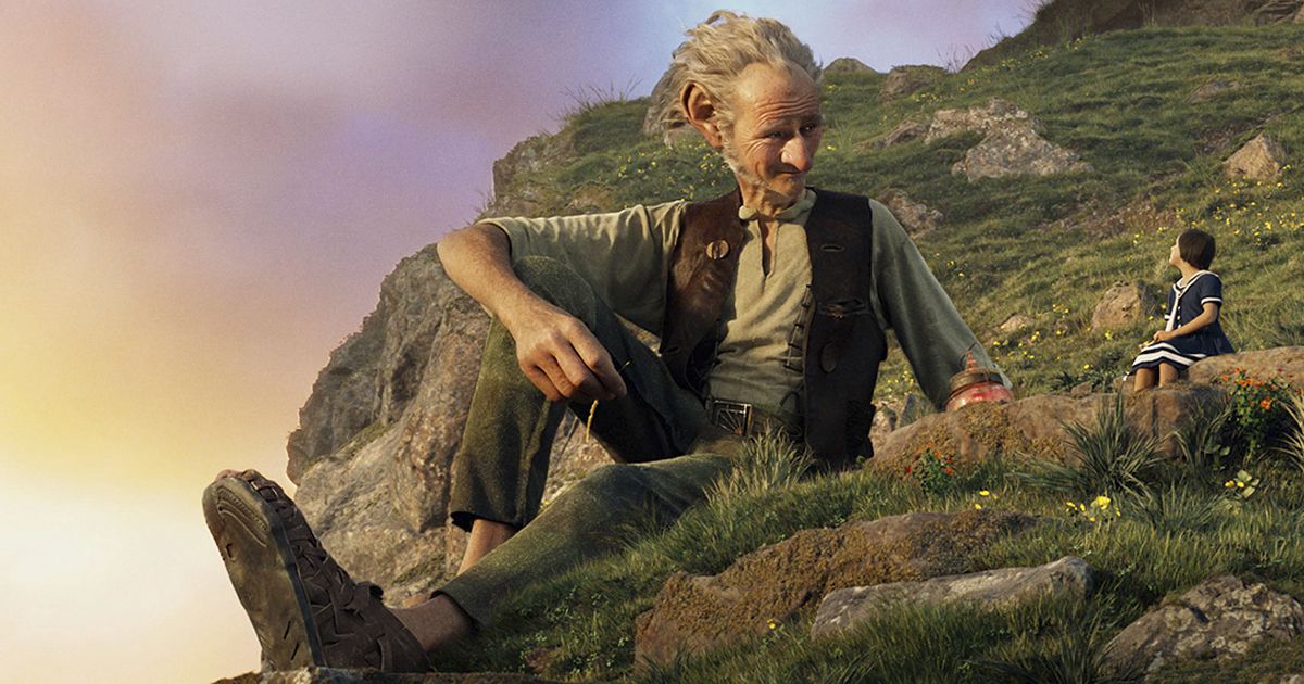 Sophie and the BFG sit on a hill in The BFG