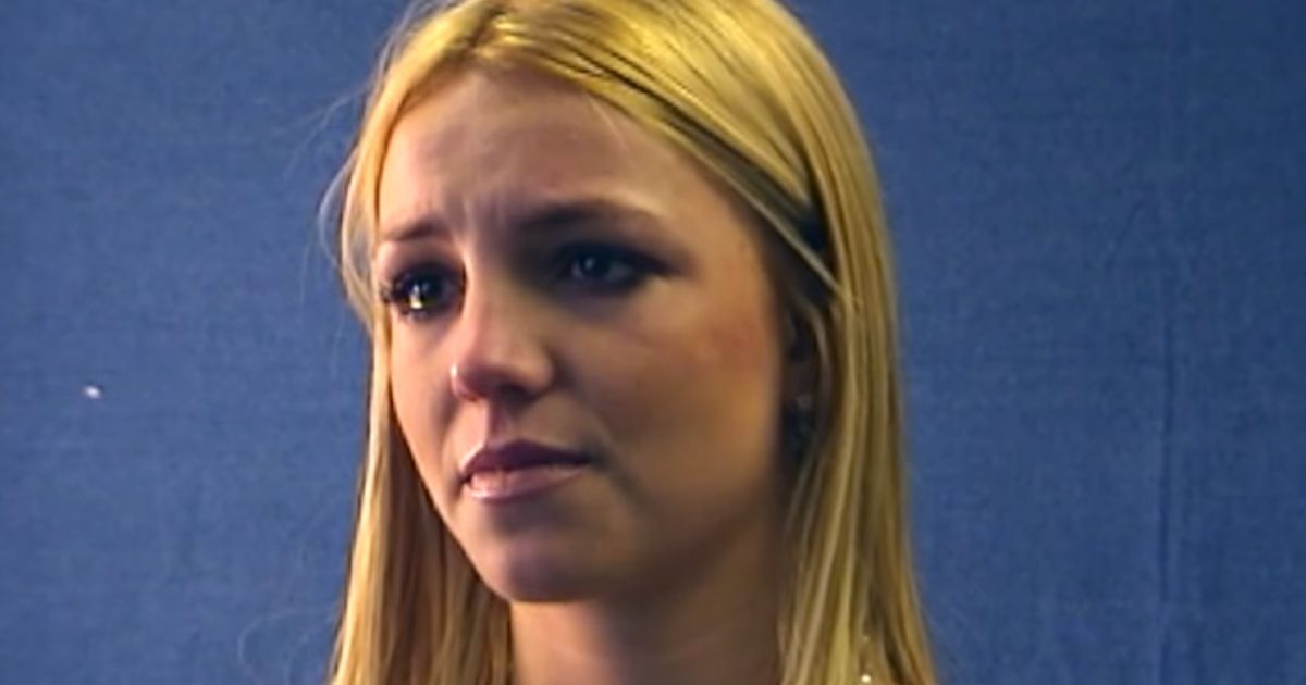 Britney Spears tearing up in front of a blue wall in an audition for The Notebook.