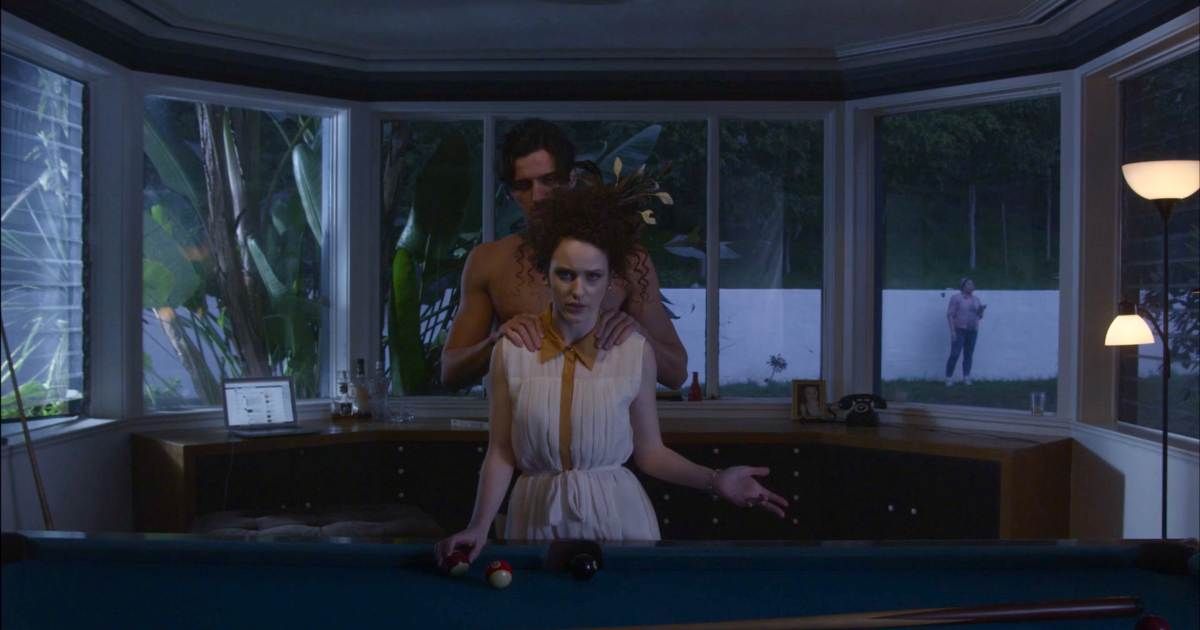 a couple playing pool in Ari Aster's Basically