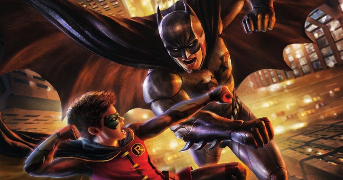 Batman and Robin punch each other in the Gotham city streets in Batman vs Robin