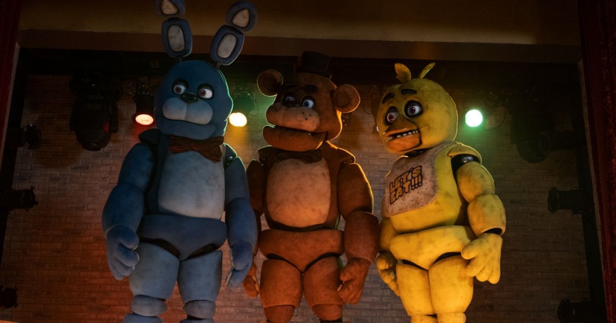 Bonnie, Freddy, and Chica all standing on the stage together in the Five Nights at Freddy's movie