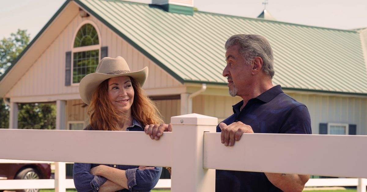 Dana Delany wears a cowboy hat and stands next to Sylvester Stallone in Tulsa King