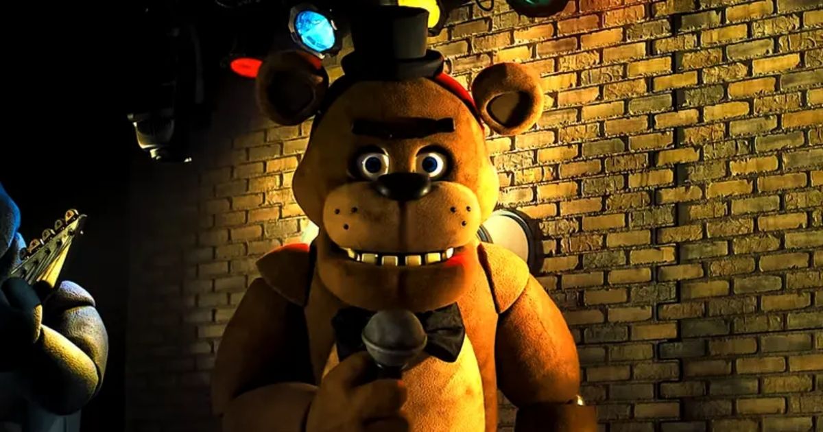 Freddy Fazbear in the Five Nights at Freddy's movie with a microphone and top hat.