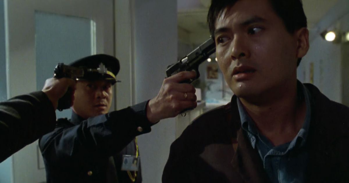 Guns at everyones head in John Woo film Hard Boiled 1992