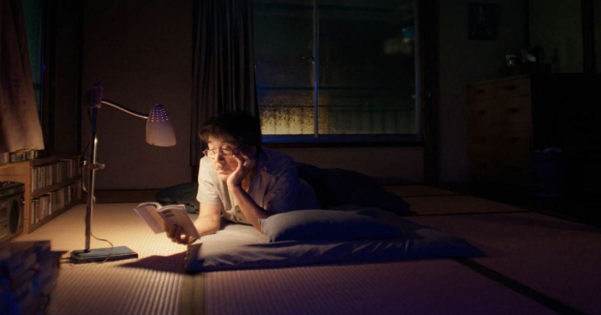 Hirayama reading a book before bed 