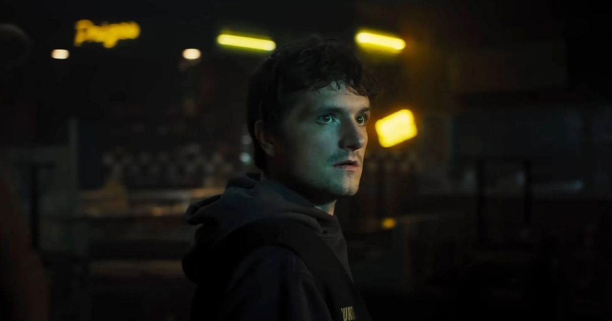 Josh Hutcherson looking at something off camera in the Five Nights at Freddy's Movie.