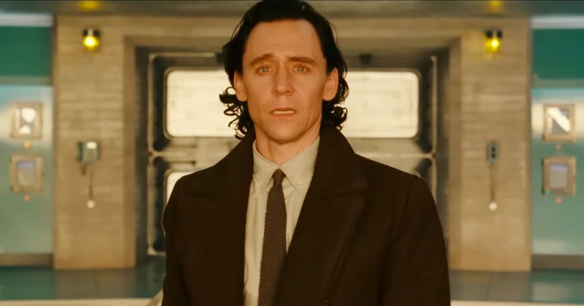 Tom Hiddleston's Loki looks horrified in the TVA while wearing a suit jacket and tie as the temporal loom explodes in the fourth episode inside the TVA.