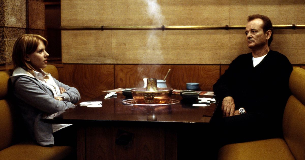 Charlotte and Bob sit in a restaurant in Lost in Translation