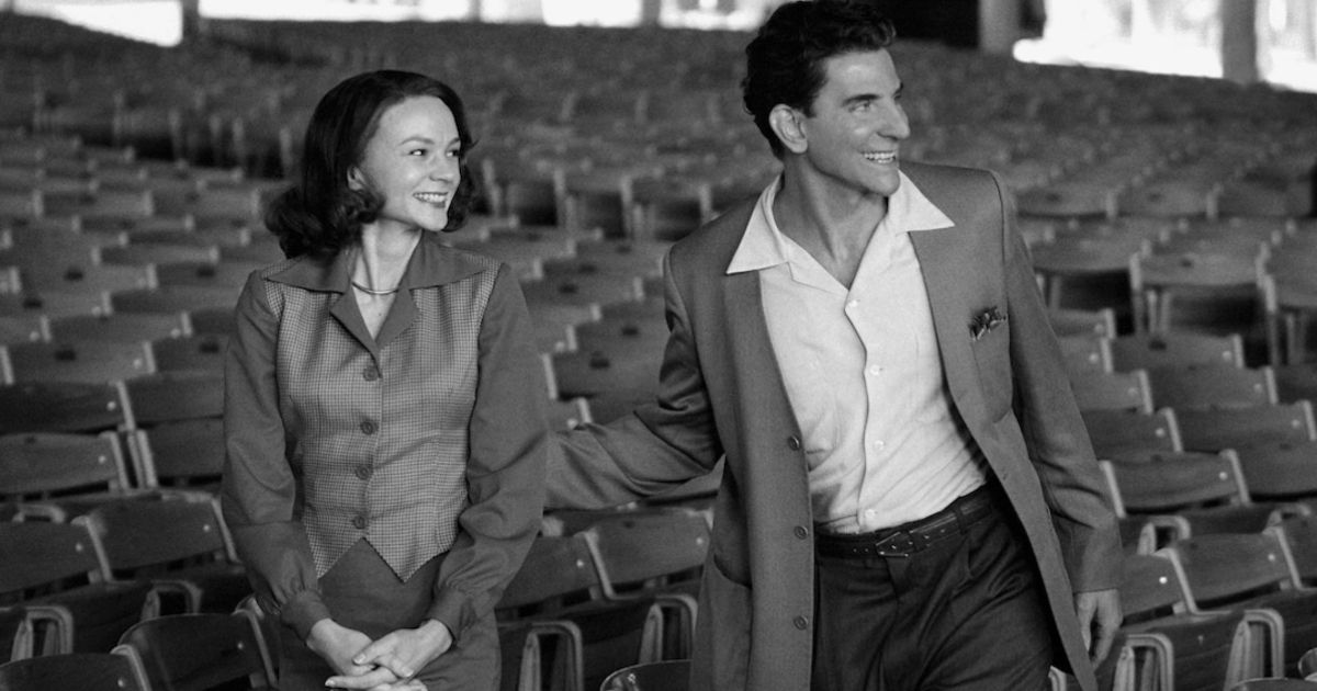 Leonard and Felicia stand in an auditorium in Maestro