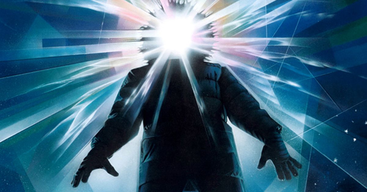 The Thing movie poster from 1982 with a man in a thick winter coat and a bright white light beaming from where his face would be.