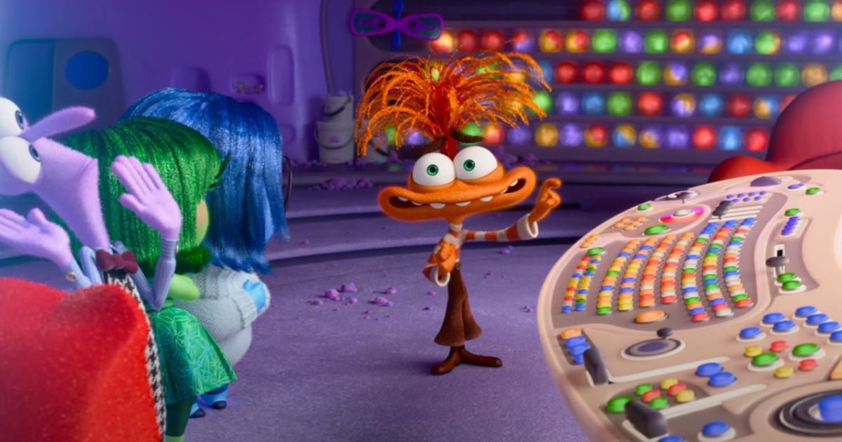 Maya Hawke as anxiety, an orange creature with a large smile and crazy hair in Inside Out 2