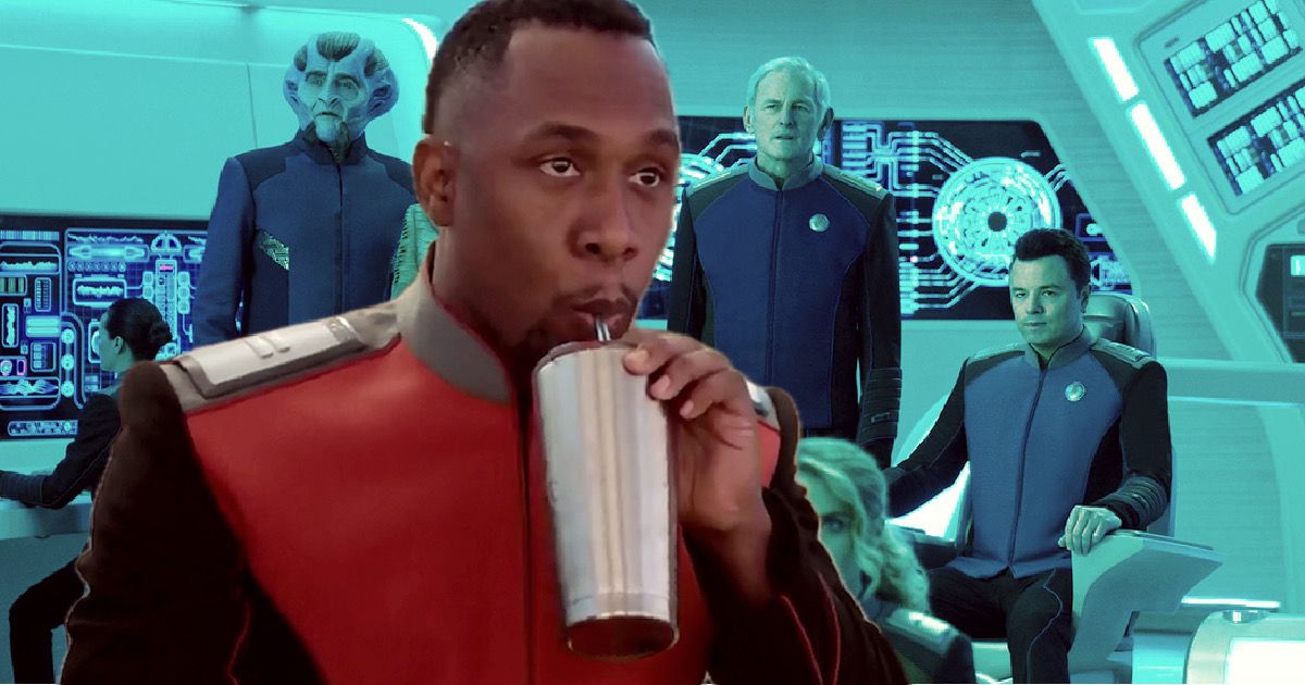 J. Lee as Lt. John LaMarr drinking from a silver cup with a scene from the bridge of the Orville behind him