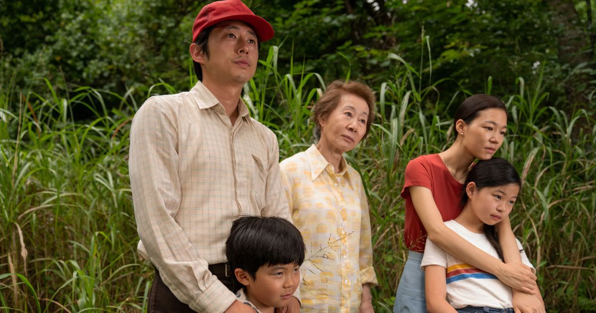The Yi family stands in a field in Minari