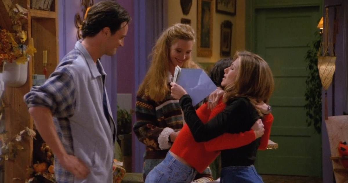 rachel and monica hug while chandler and phoebe watch in episode the one where underdog gets away