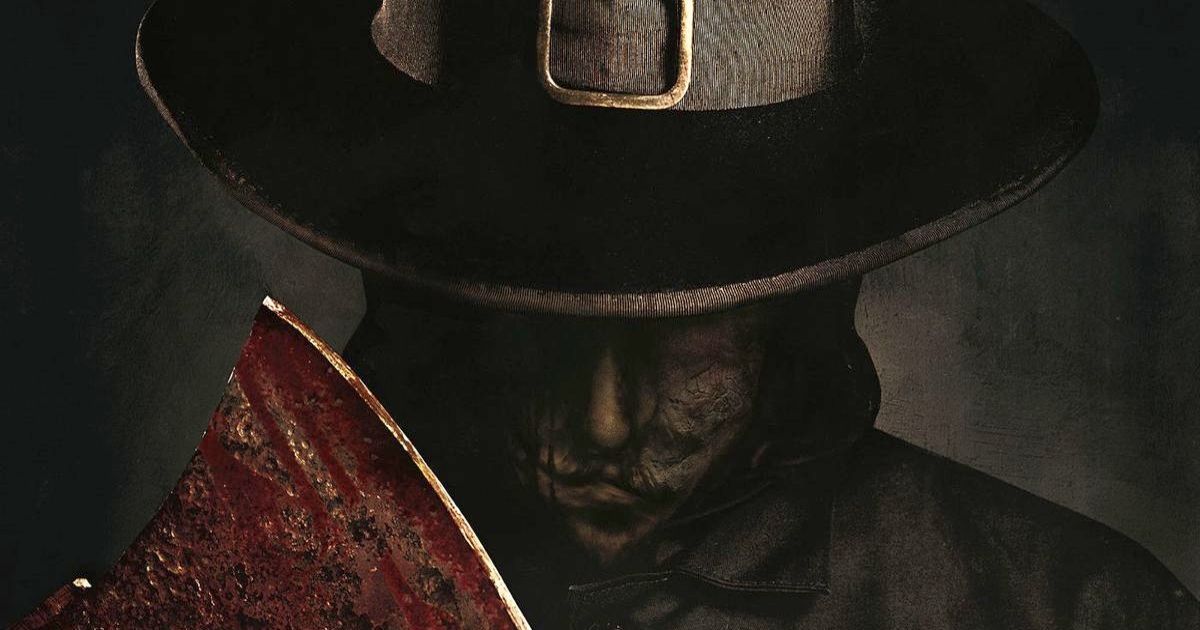 John Carver wearing a pilgrim hat and mask, carrying a bloody axe in a poster for Eli Roth's Thanksgiving.