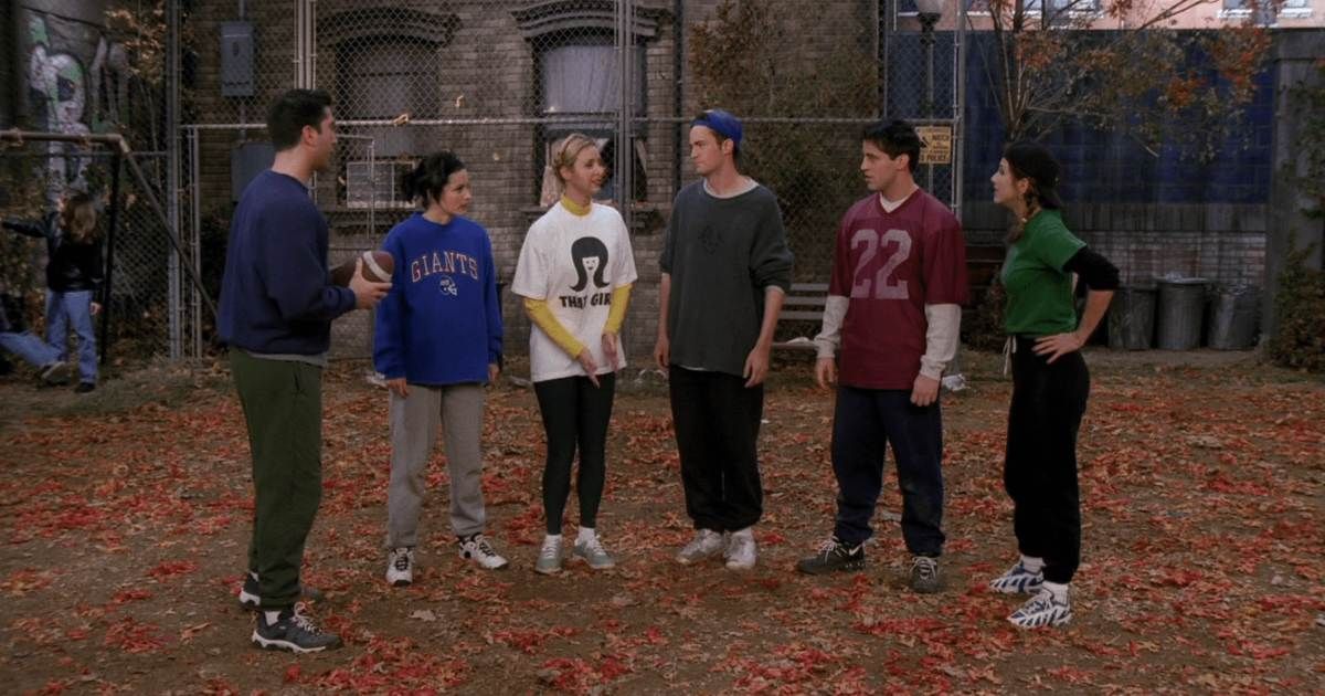 the cast of friends prepares to play football in episode the one with the football