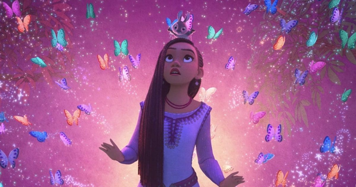Asha de Wish, interpretada por Ariana DeBose, olhando para uma explosão colorida com borboletas ao seu redor.