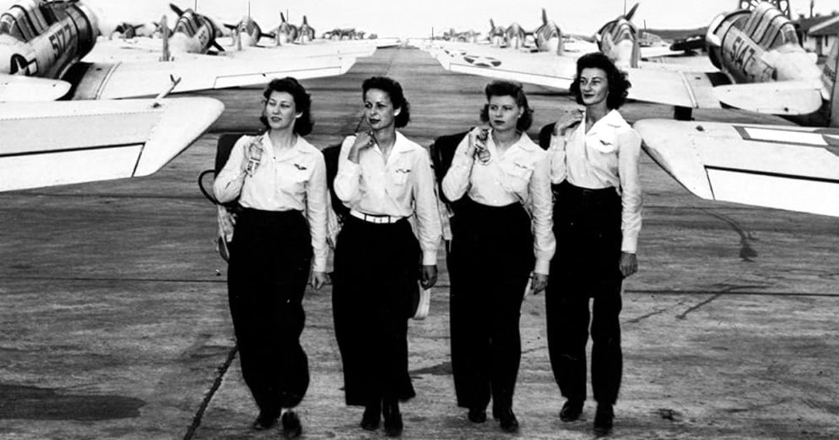 Women stand before warplanes in Women with Silver Wings