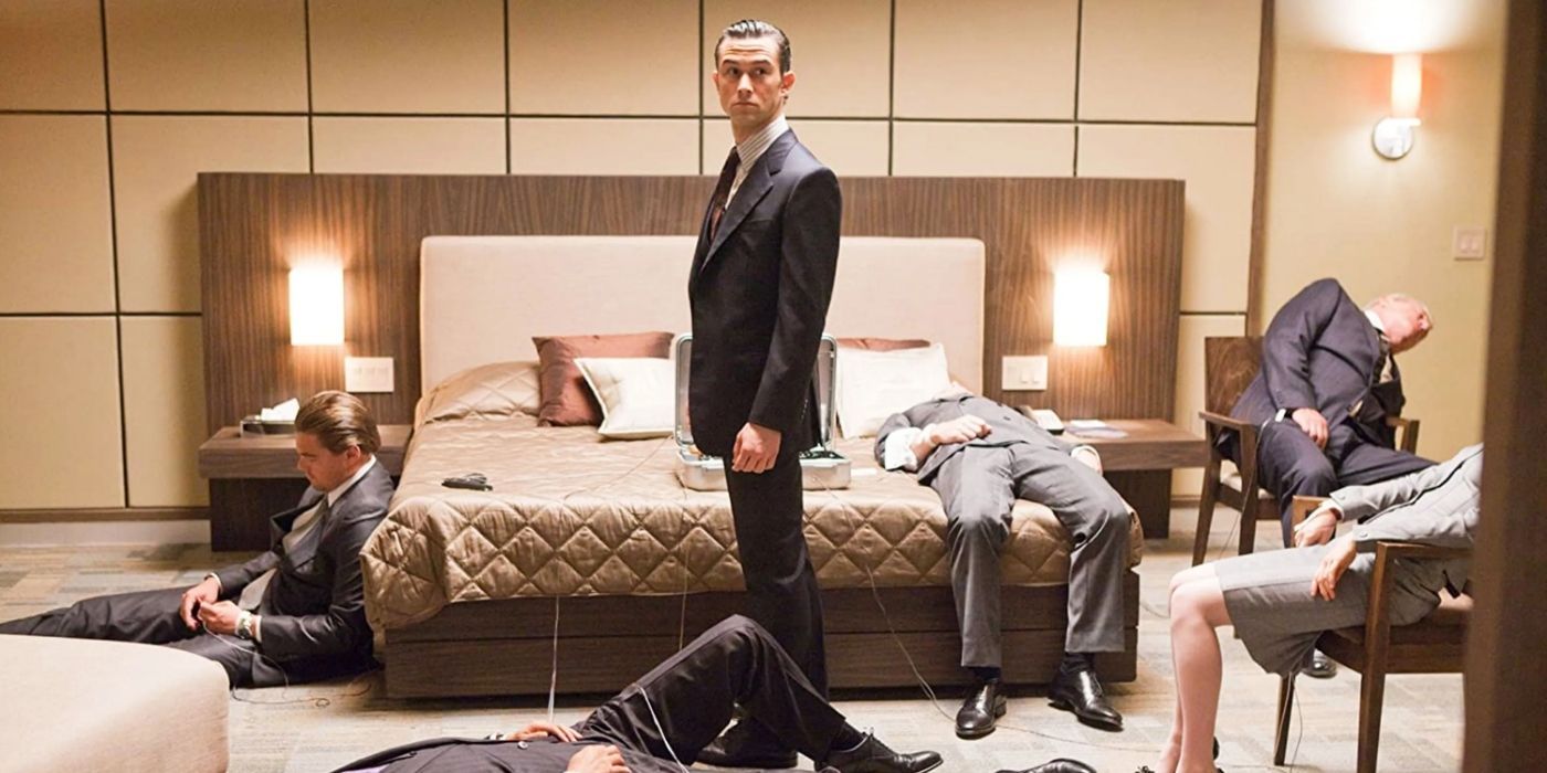 A scene from Inception (2014) Joseph Gordon-Levitt stands in a bedroom with collapsed people around him
