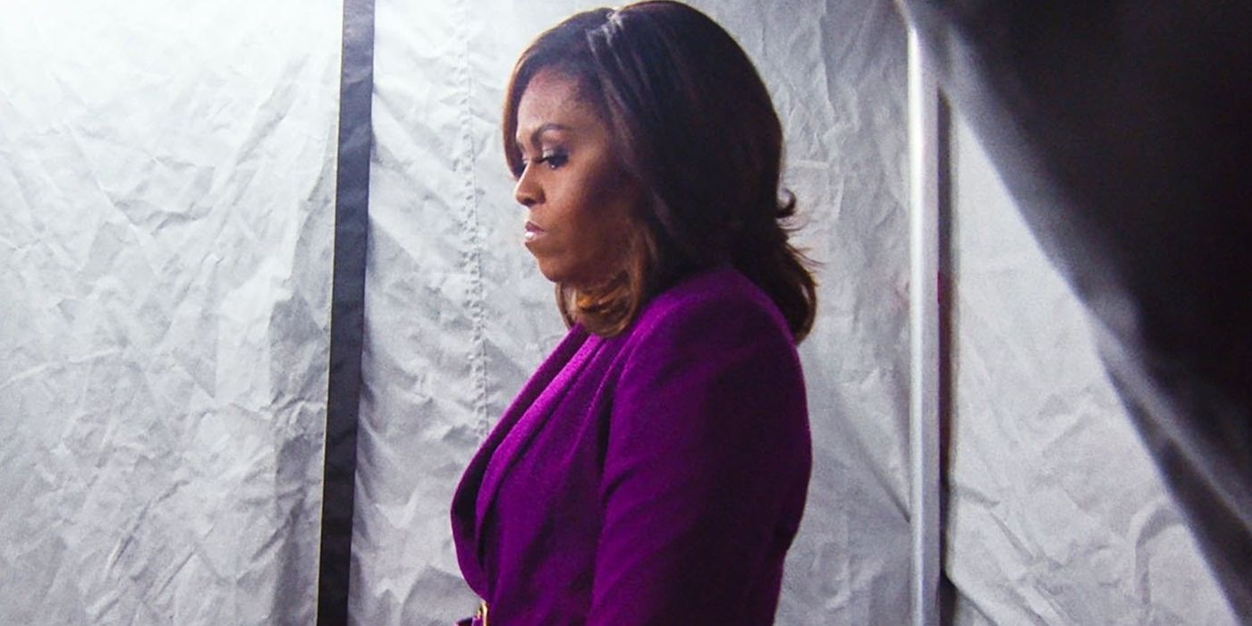 Michelle Obama stands in profile in Becoming