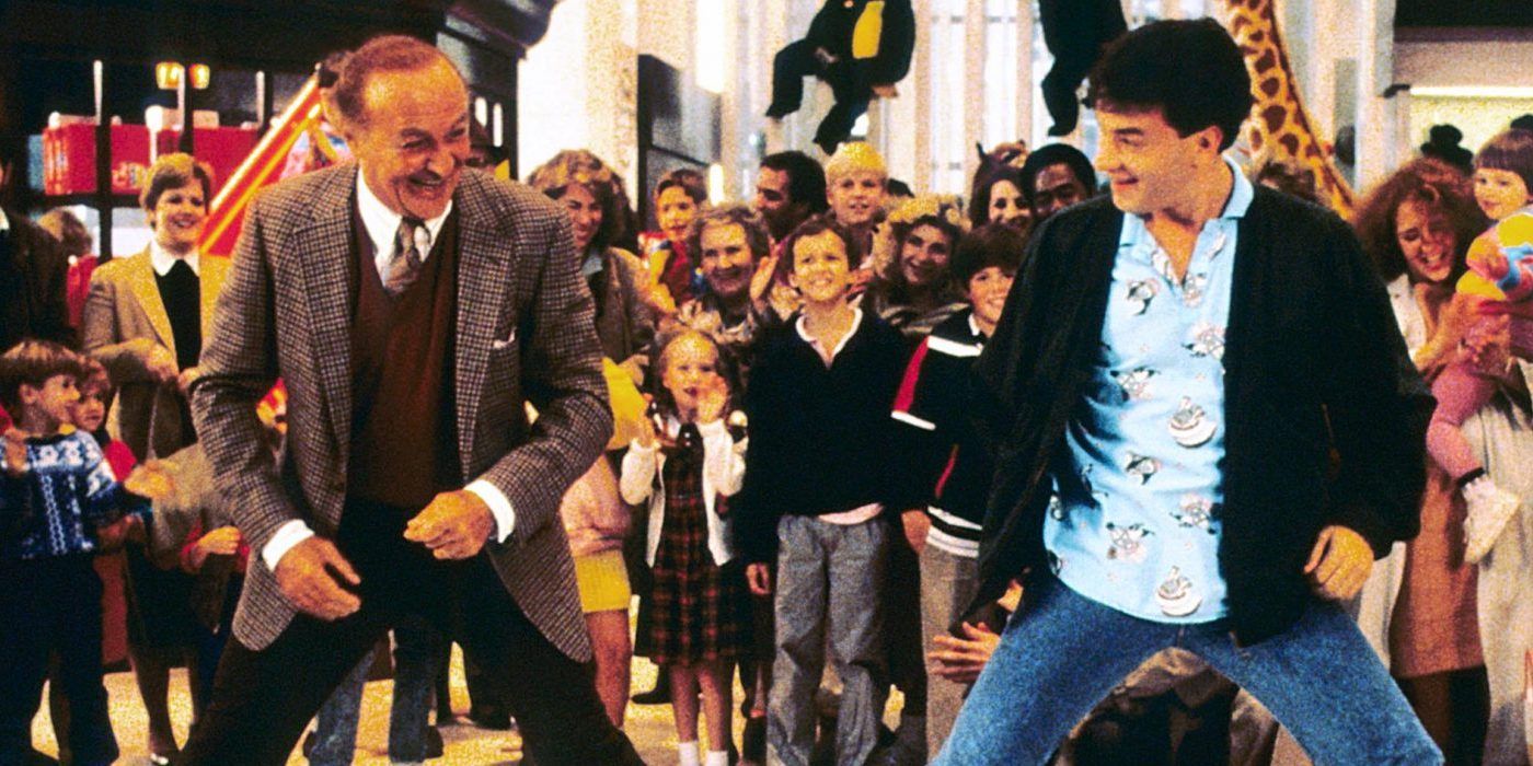 Big Tom Hanks as Josh Baskin playing on piano in a toy store