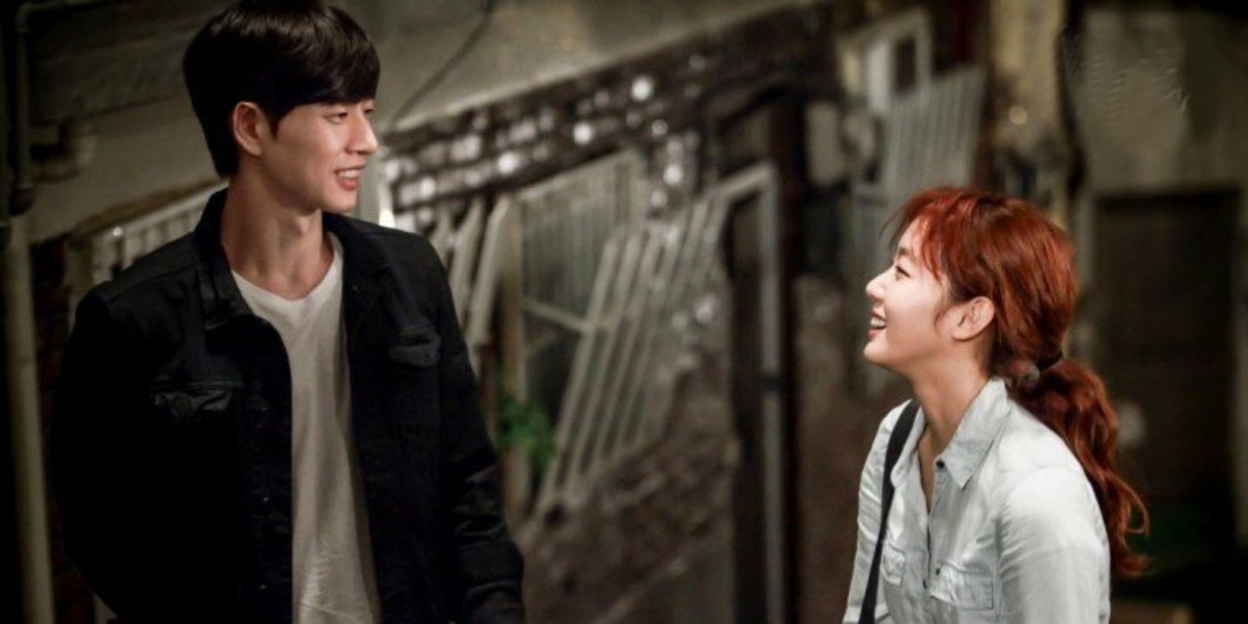 Cheese in the Trap leads smile at each other in a grungy alleyway