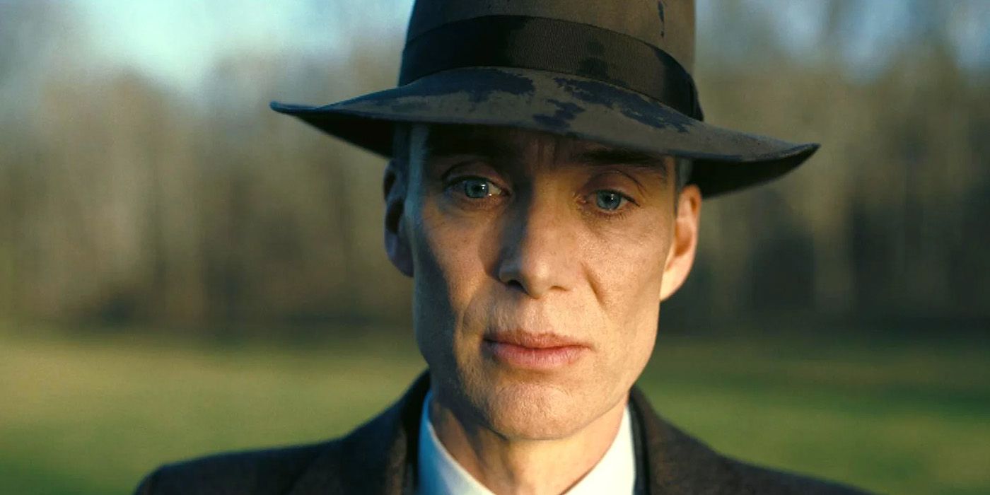 Cillian Murphy as Oppenheimer wearing a suit and hat in Oppenheimer 