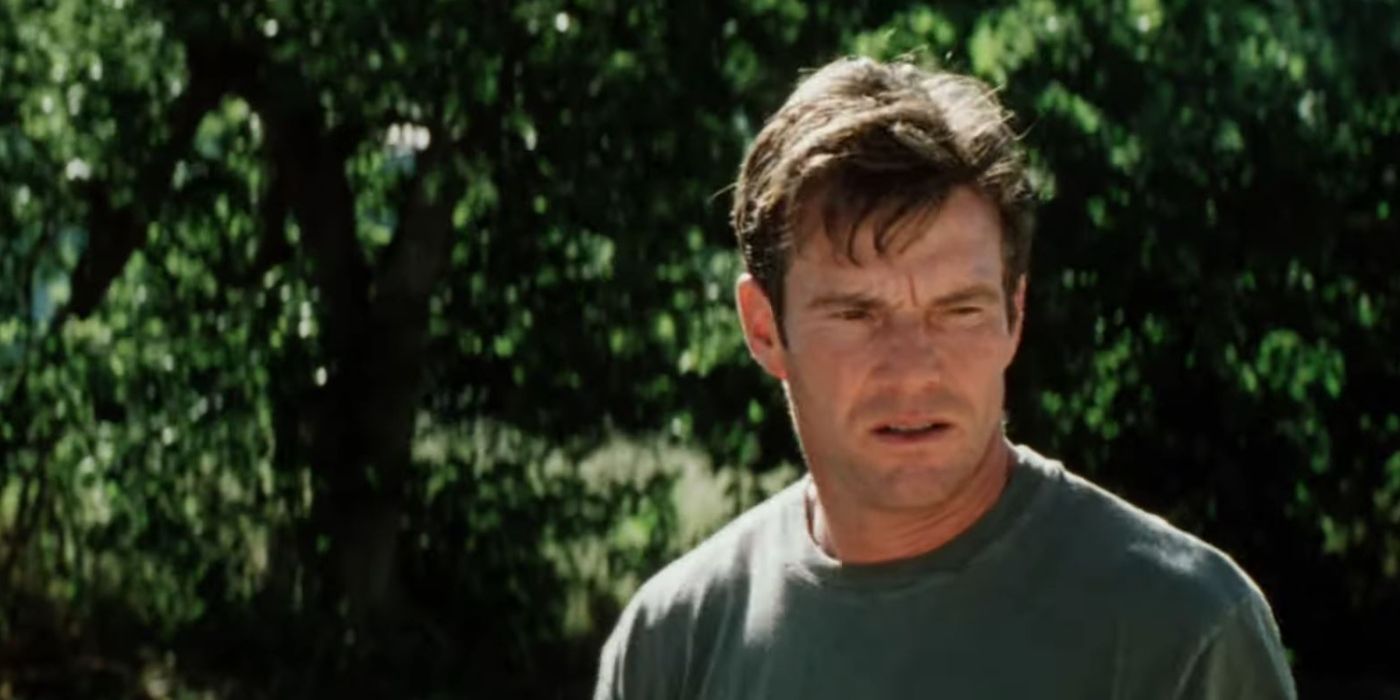 Dennis quaid wearing a green T-shirt looking doubtful in a still from The Rookie