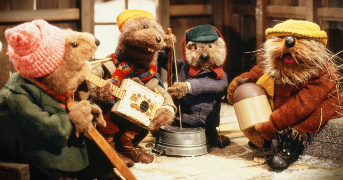 Jug-Band de Emmet Otter Natal de 1977, as lontras sentam-se juntas tocando instrumentos em uma jug band