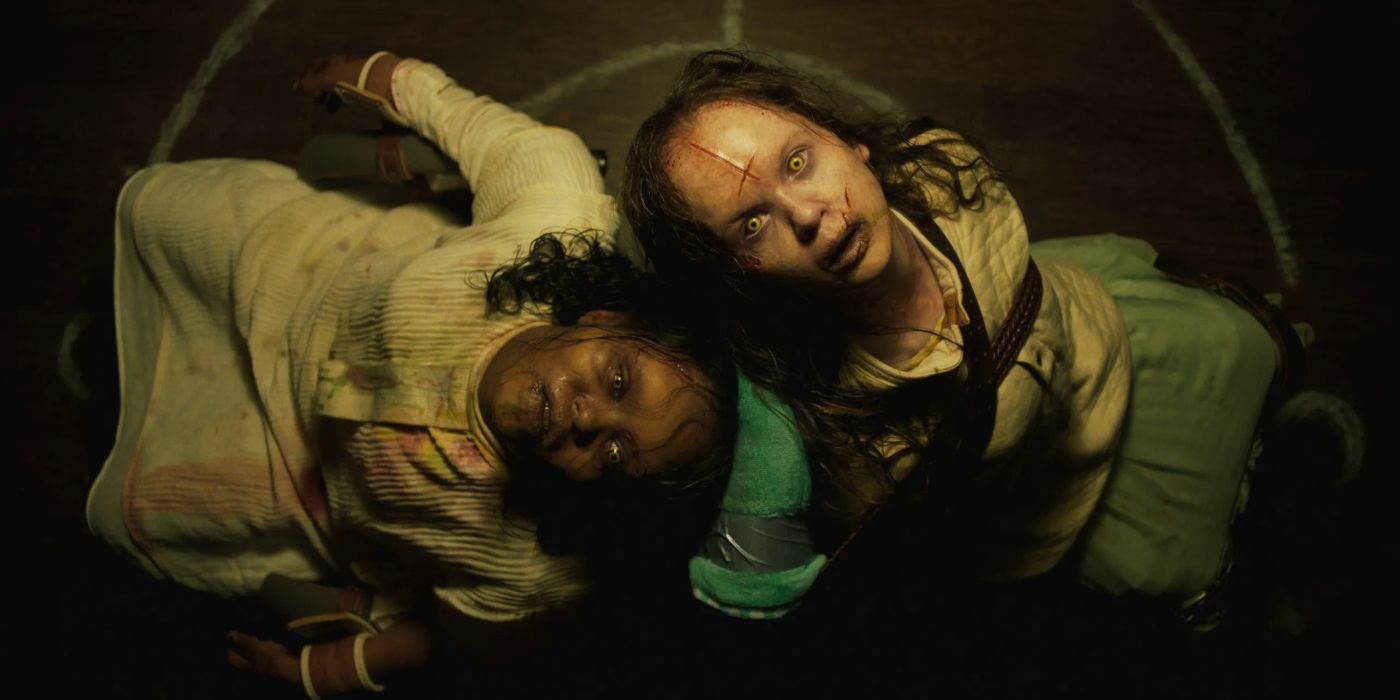 two girls look possessed as they look up while being strapped to chairs in a still from The Exorcist Believer