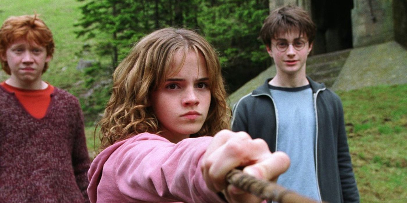 Harry Potter and the Prisoner of Azkaban Emma Watson as Hermione threatens Draco while Rupert Grint as Ron and Daniel Radcliffe as Harry watch in awe