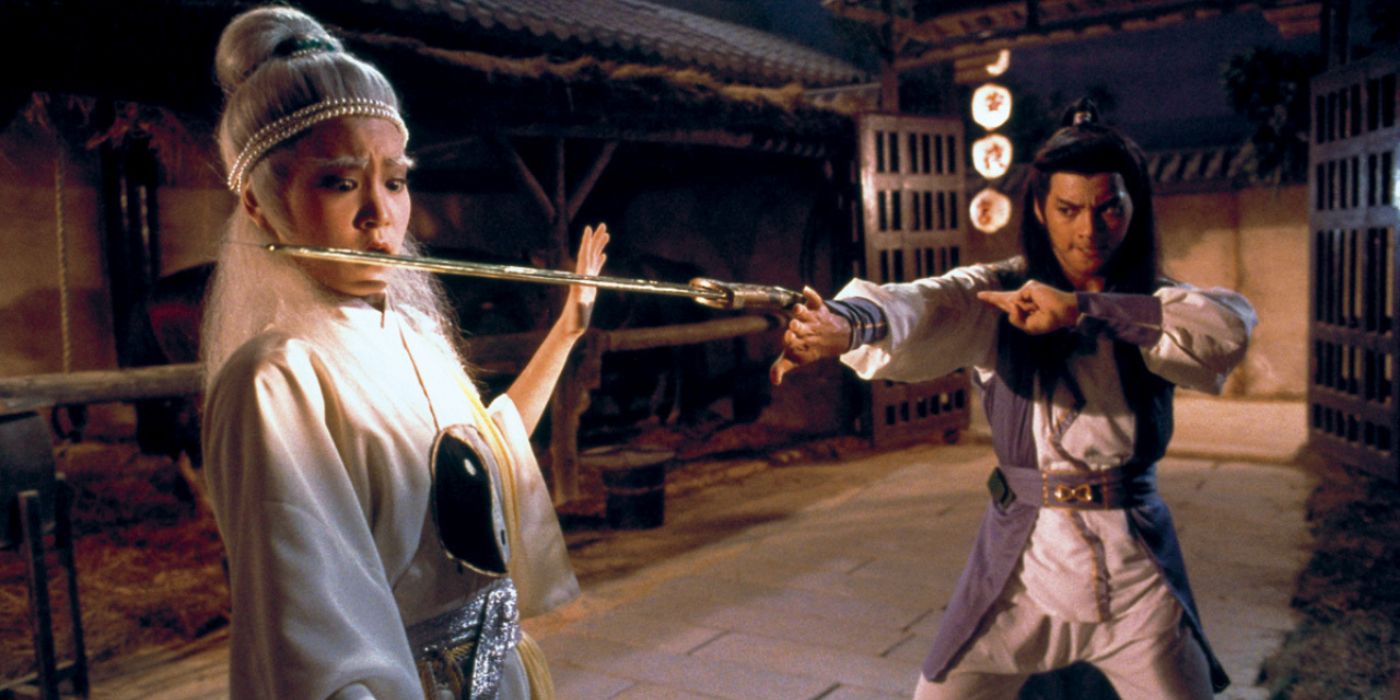 Holy Flame of the Martial World a man holds a sword to a woman
