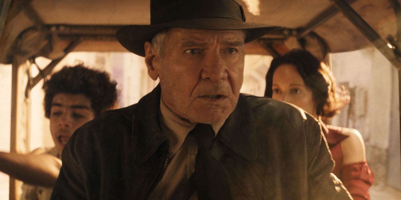 Indiana jones is chased on small car with girl and a boy in indiana jones and the dial of destiny