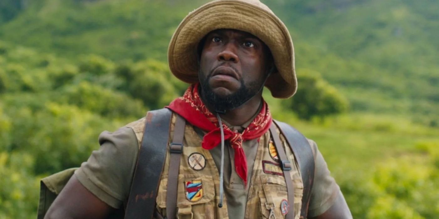 Kevin Hart frowning, wearing a hat and red bandana around his neck in Jumanji: Welcome to the Jungle